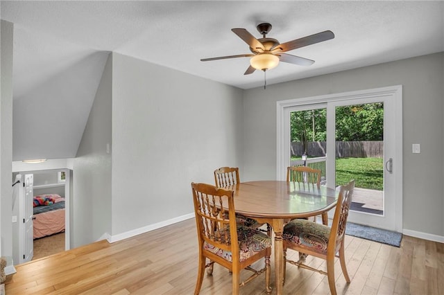 1018 S Elm St, Ottawa, KS 66067 - dining area featuring light wood-style flooring, baseboards, a ceiling fan, and a textured ceiling