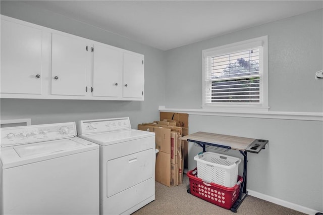 1018 S Elm St, Ottawa, KS 66067 - washroom featuring separate washer and dryer, cabinet space, light colored carpet, and baseboards