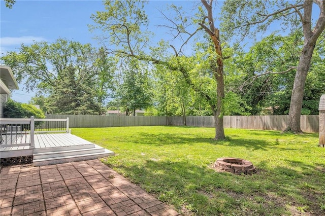 1018 S Elm St, Ottawa, KS 66067 - view of yard featuring an outdoor fire pit and a wooden deck