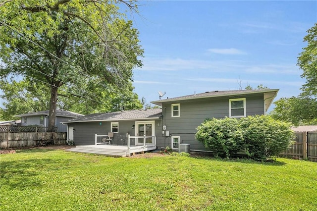 1018 S Elm St, Ottawa, KS 66067 - rear view of property featuring a deck and central air condition unit