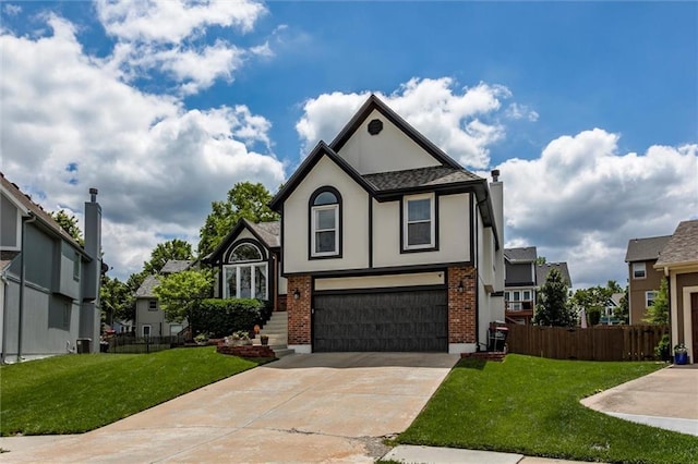 21625 W 53rd Ter, Shawnee, KS 66226 - tudor home with a garage, driveway, brick siding, and stucco siding
