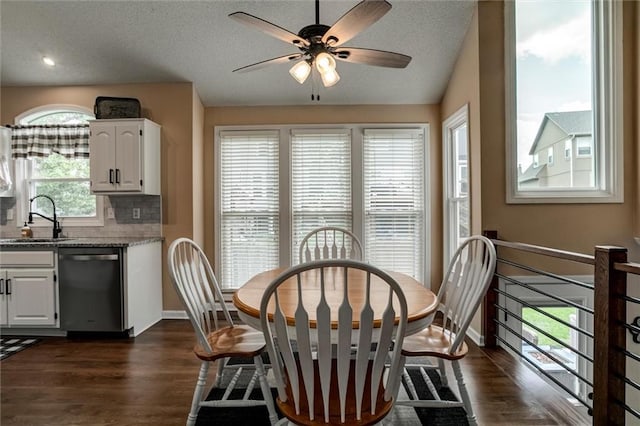 21625 W 53rd Ter, Shawnee, KS 66226 - dining room with dark wood-style flooring, ceiling fan, baseboards, and a textured ceiling
