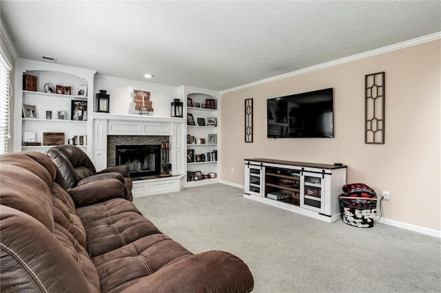 21625 W 53rd Ter, Shawnee, KS 66226 - living area with a textured ceiling, a stone fireplace, baseboards, carpet flooring, and built in shelves
