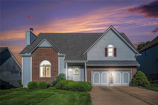 3304 Tepee Ct, Independence, MO 64057 - traditional-style house with brick siding, concrete driveway, and a garage