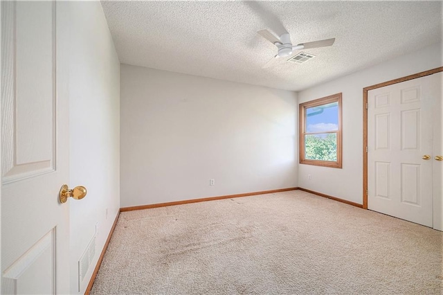 3304 Tepee Ct, Independence, MO 64057 - unfurnished bedroom with carpet flooring, a textured ceiling, baseboards, and a ceiling fan