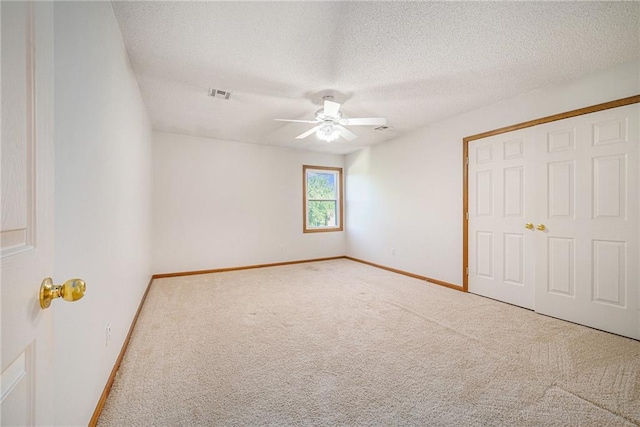 3304 Tepee Ct, Independence, MO 64057 - unfurnished bedroom with carpet flooring, a textured ceiling, baseboards, ceiling fan, and a closet