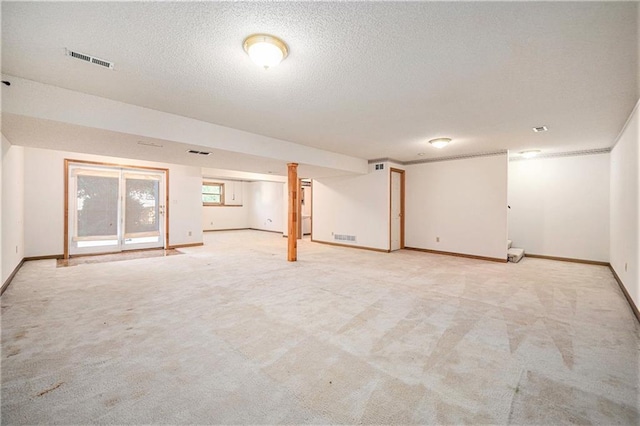 3304 Tepee Ct, Independence, MO 64057 - below grade area featuring light carpet, baseboards, and a textured ceiling