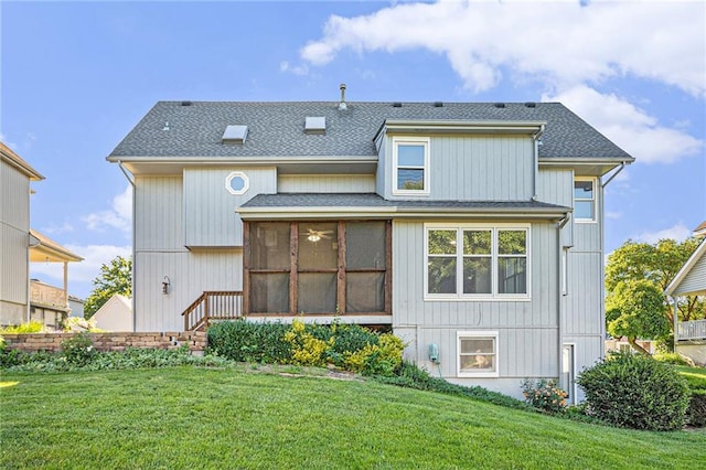 3304 Tepee Ct, Independence, MO 64057 - rear view of house featuring a sunroom, roof with shingles, and a yard