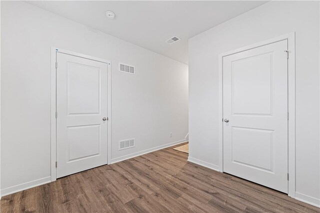 5004 NW 141st St, Platte City, MO 64079 - unfurnished bedroom featuring wood finished floors and baseboards