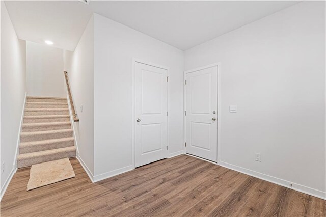 5004 NW 141st St, Platte City, MO 64079 - entrance foyer featuring wood finished floors, baseboards, and stairway