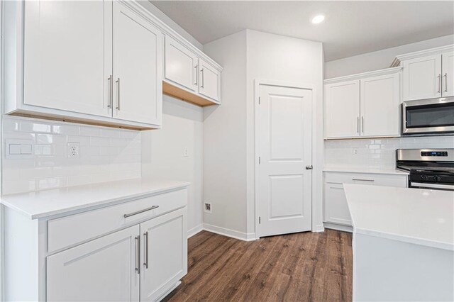 5004 NW 141st St, Platte City, MO 64079 - kitchen featuring appliances with stainless steel finishes, dark wood-style floors, white cabinetry, baseboards, and recessed lighting
