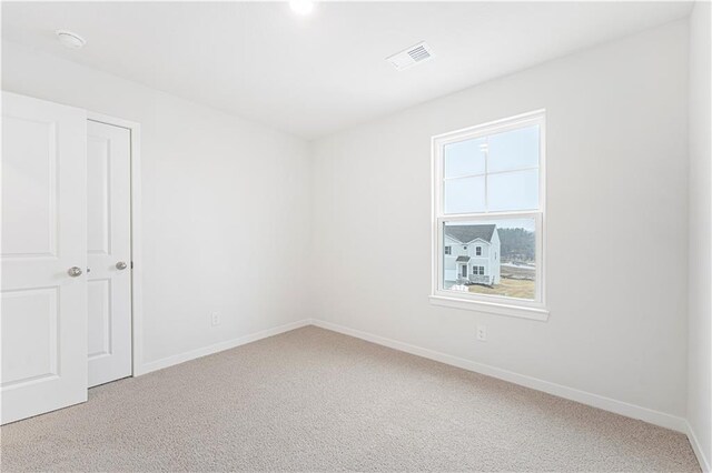 5004 NW 141st St, Platte City, MO 64079 - unfurnished room featuring light colored carpet, baseboards, and a smoke detector