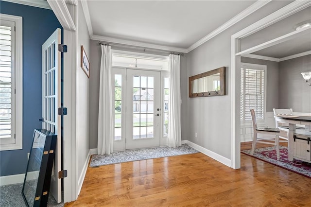 1602 SW Deer Run Rd, Oak Grove, MO 64075 - foyer featuring wood finished floors, crown molding, a chandelier, and baseboards