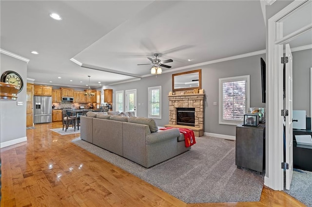 1602 SW Deer Run Rd, Oak Grove, MO 64075 - living room featuring a ceiling fan, recessed lighting, baseboards, a fireplace, and ornamental molding