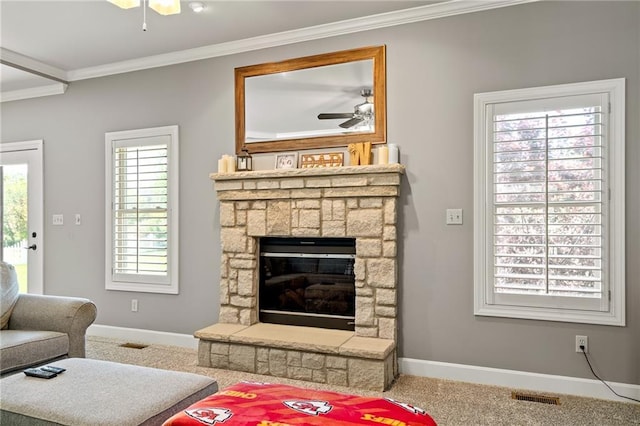 1602 SW Deer Run Rd, Oak Grove, MO 64075 - carpeted living room featuring a ceiling fan, baseboards, crown molding, and a fireplace