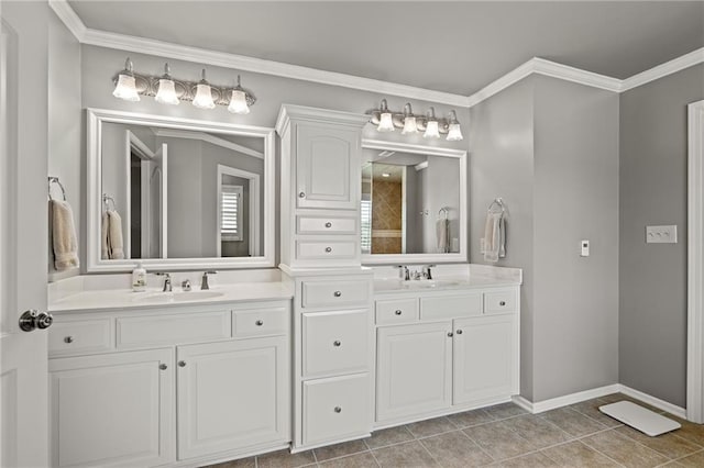 1602 SW Deer Run Rd, Oak Grove, MO 64075 - bathroom featuring double vanity, crown molding, tile patterned flooring, and baseboards