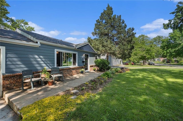 11410 W 68th Ter, Shawnee, KS 66203 - view of grassy yard featuring a patio area