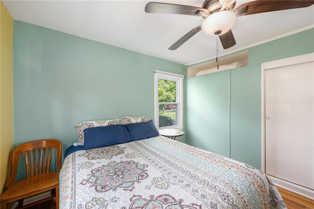 11410 W 68th Ter, Shawnee, KS 66203 - bedroom featuring wood finished floors and a ceiling fan