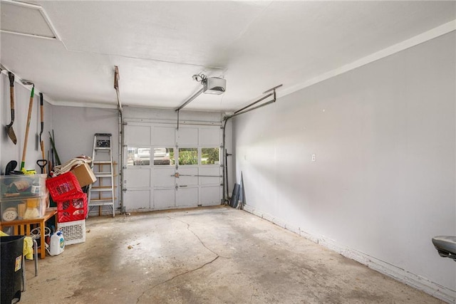 11410 W 68th Ter, Shawnee, KS 66203 - garage featuring a garage door opener and baseboards