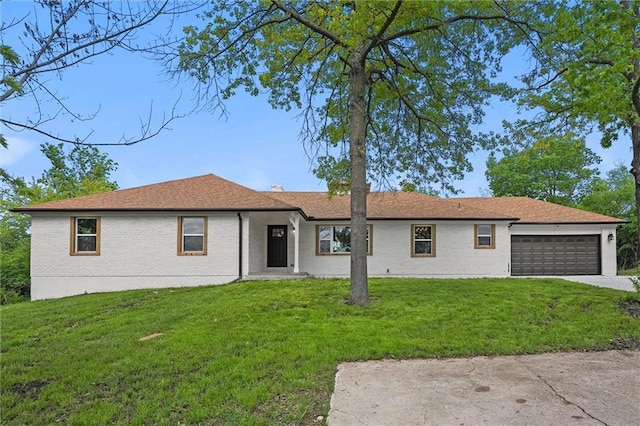 308 N 22nd St, Leavenworth, KS 66048 - single story home with a front lawn, an attached garage, brick siding, and concrete driveway