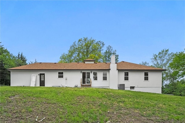 308 N 22nd St, Leavenworth, KS 66048 - rear view of property featuring a lawn, a chimney, and entry steps