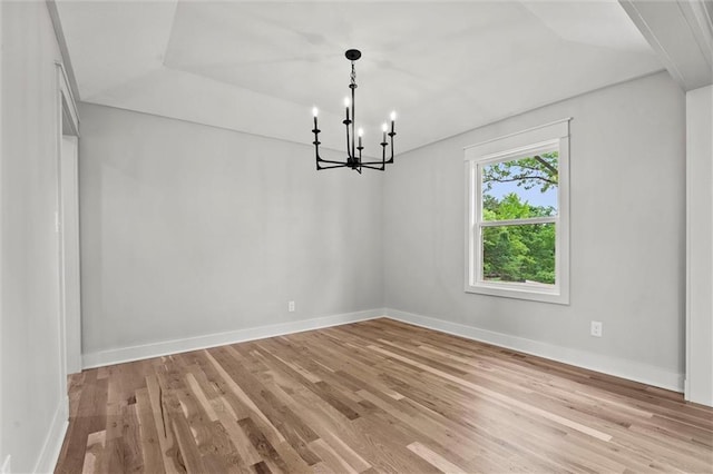 308 N 22nd St, Leavenworth, KS 66048 - spare room with light wood-style floors, a chandelier, and baseboards