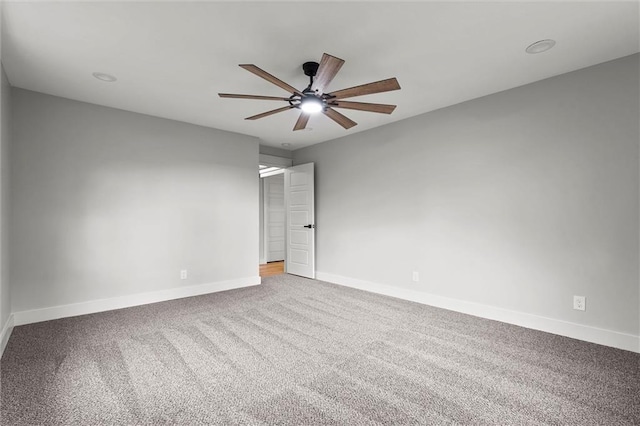 308 N 22nd St, Leavenworth, KS 66048 - unfurnished bedroom with baseboards, carpet, and a ceiling fan