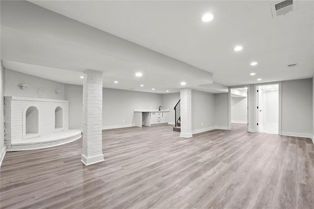 308 N 22nd St, Leavenworth, KS 66048 - finished below grade area featuring light wood finished floors, baseboards, recessed lighting, and stairs