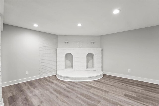 308 N 22nd St, Leavenworth, KS 66048 - unfurnished living room with recessed lighting, wood finished floors, and baseboards