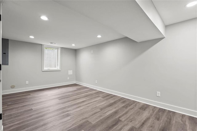 308 N 22nd St, Leavenworth, KS 66048 - below grade area with wood finished floors, baseboards, recessed lighting, and electric panel