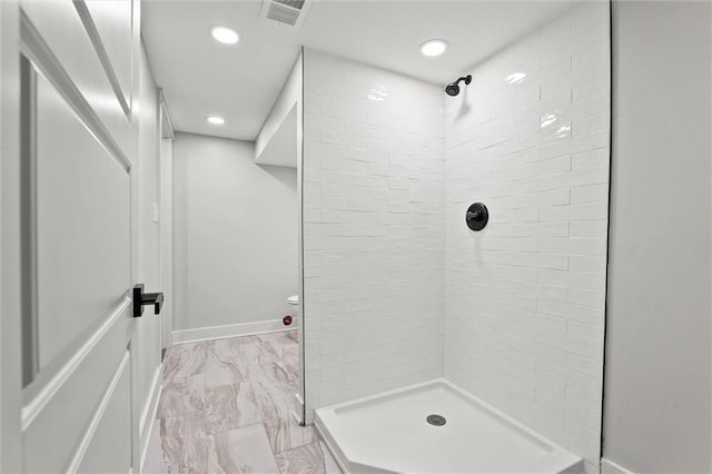 308 N 22nd St, Leavenworth, KS 66048 - full bathroom featuring tiled shower, marble look tiles, and recessed lighting
