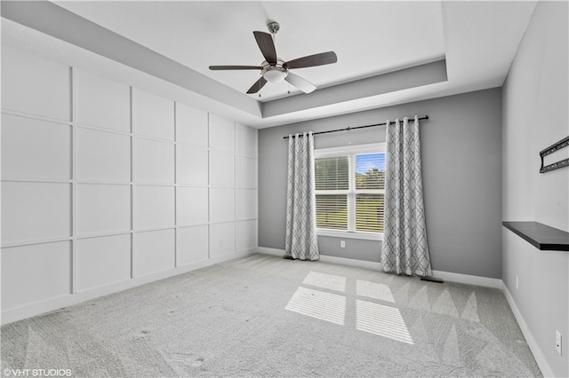 10429 W 170th Pl, Overland Park, KS 66221 - carpeted spare room featuring a ceiling fan and a tray ceiling