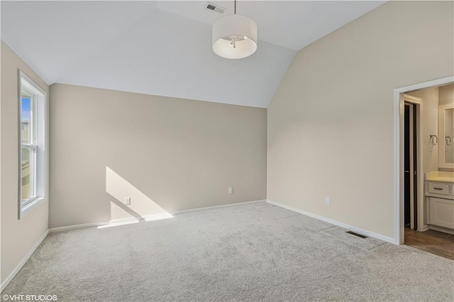 10429 W 170th Pl, Overland Park, KS 66221 - carpeted empty room featuring lofted ceiling and healthy amount of natural light
