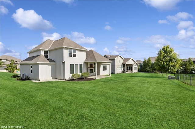 10429 W 170th Pl, Overland Park, KS 66221 - rear view of house with a shingled roof and a patio