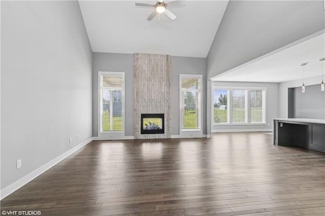 10429 W 170th Pl, Overland Park, KS 66221 - unfurnished living room featuring high vaulted ceiling, a ceiling fan, plenty of natural light, hardwood / wood-style flooring, and a fireplace
