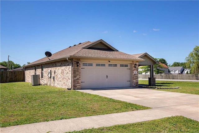 102 Zachary Ln, Carl Junction, MO 64834 - view of front of house with central AC unit, an attached garage, driveway, brick siding, and a shingled roof
