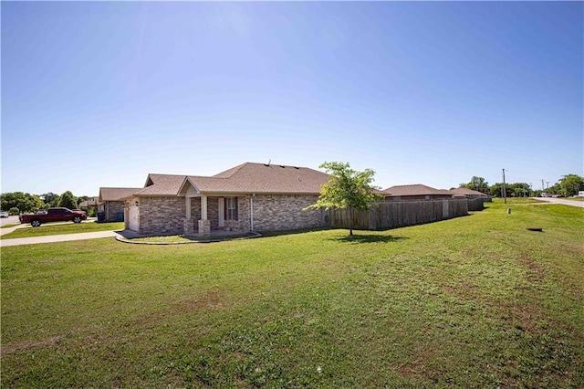 102 Zachary Ln, Carl Junction, MO 64834 - view of home's exterior featuring an attached garage, concrete driveway, and brick siding