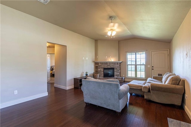 102 Zachary Ln, Carl Junction, MO 64834 - living room featuring dark wood-style floors, baseboards, lofted ceiling, a glass covered fireplace, and ceiling fan