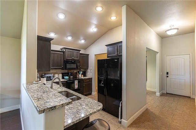 102 Zachary Ln, Carl Junction, MO 64834 - kitchen with black appliances, a sink, dark brown cabinets, a peninsula, and light stone counters