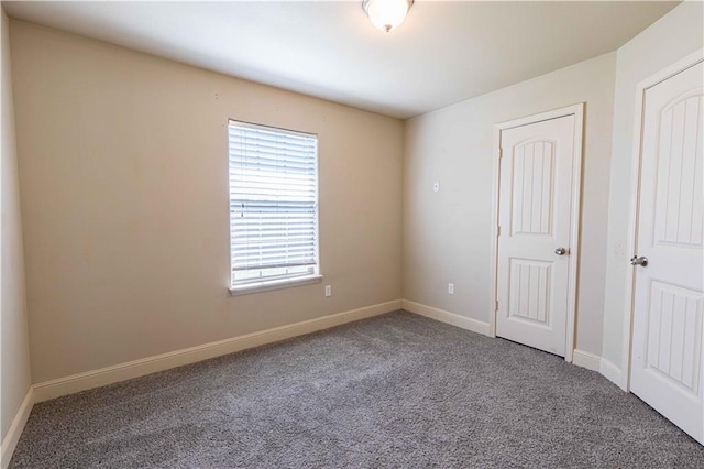 102 Zachary Ln, Carl Junction, MO 64834 - unfurnished bedroom with carpet and baseboards