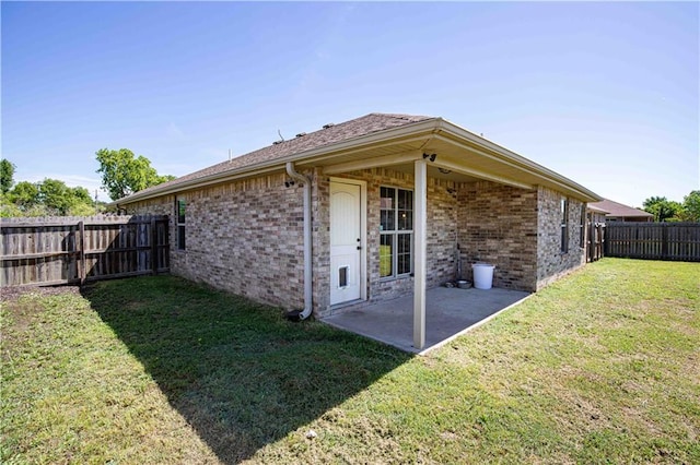 102 Zachary Ln, Carl Junction, MO 64834 - view of side of home featuring a patio and brick siding