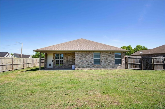 102 Zachary Ln, Carl Junction, MO 64834 - rear view of property with brick siding