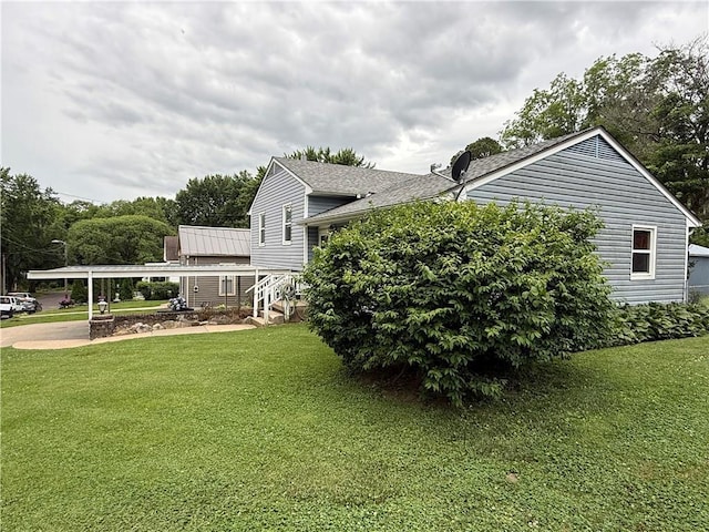 316 N 18th St, Lexington, MO 64067 - view of home's exterior featuring a lawn and roof with shingles