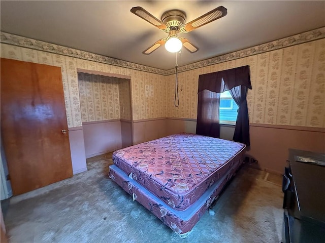 316 N 18th St, Lexington, MO 64067 - carpeted bedroom featuring wallpapered walls, wainscoting, and ceiling fan