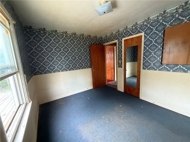 316 N 18th St, Lexington, MO 64067 - empty room featuring wallpapered walls and baseboards