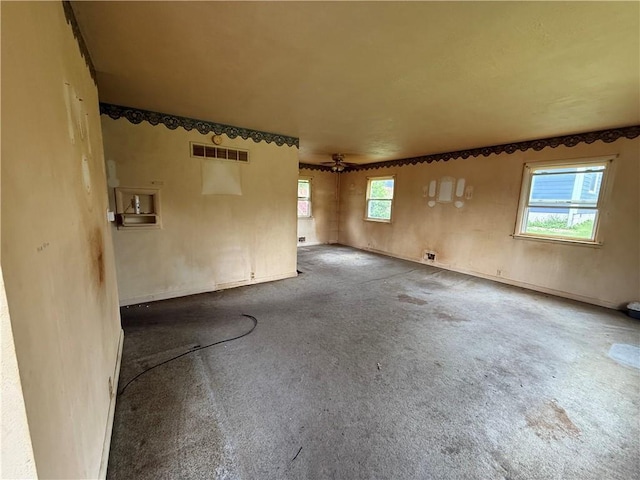 316 N 18th St, Lexington, MO 64067 - carpeted empty room featuring plenty of natural light and a ceiling fan