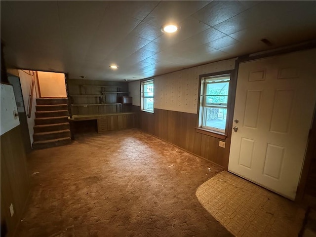 316 N 18th St, Lexington, MO 64067 - carpeted foyer featuring wainscoting, wooden walls, and stairway