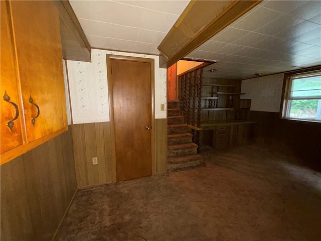 316 N 18th St, Lexington, MO 64067 - below grade area featuring wainscoting, stairs, wooden walls, carpet flooring, and a drop ceiling