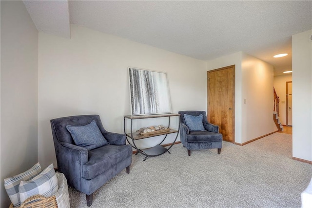 1101 Jeff Cir, Paola, KS 66071 - sitting room featuring carpet flooring, stairs, and baseboards