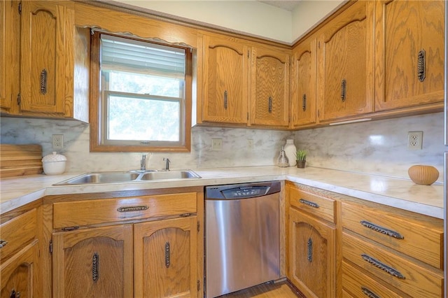 1101 Jeff Cir, Paola, KS 66071 - kitchen with dishwasher, a sink, light countertops, brown cabinets, and backsplash